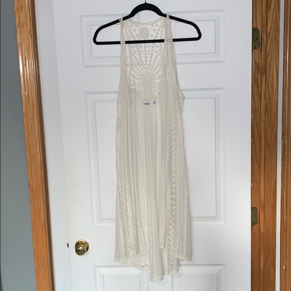 Cream sleeveless cover top